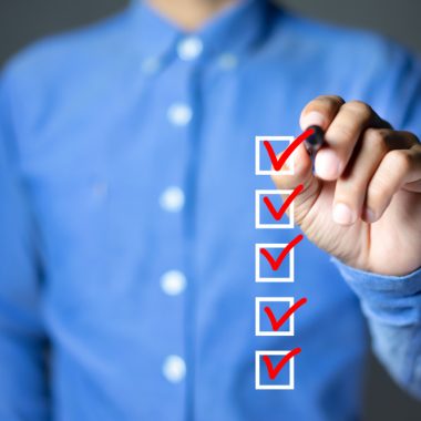 Man crossing off a checklist