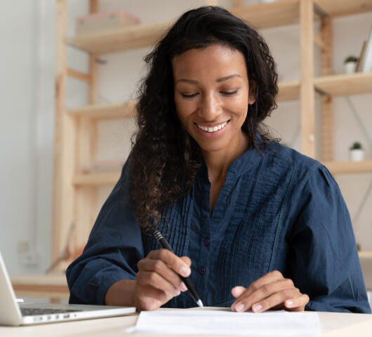 woman working with papers and calculating