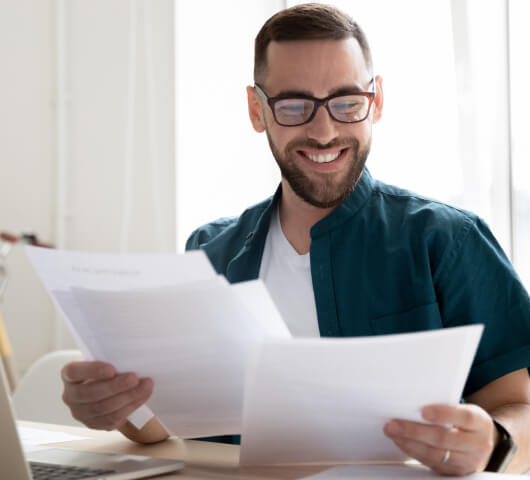 man working with papers