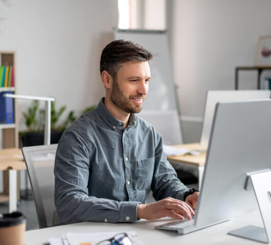 man working on a desktop