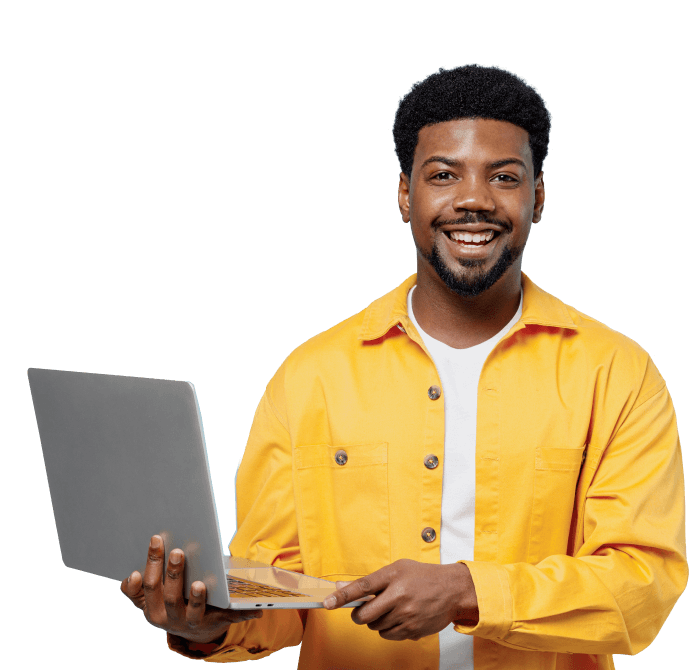 Man smiling with laptop open
