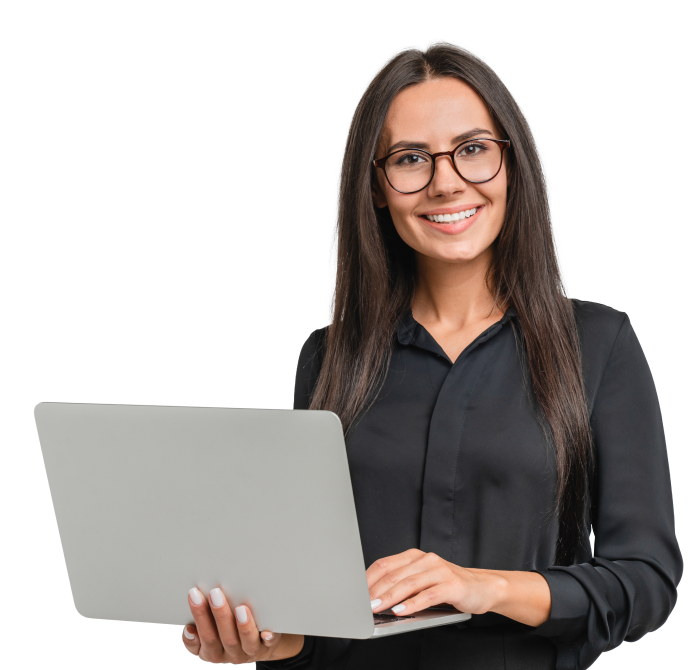 smiling woman stands with a laptop
