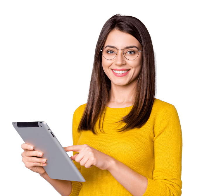 smiling woman stands with a tablet