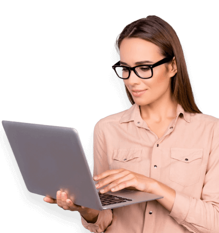 woman smiling holding a laptop