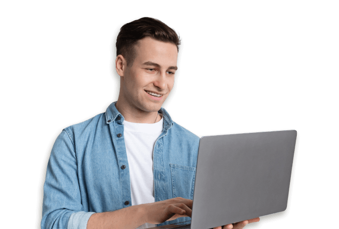 man smiling looking at a laptop