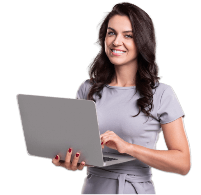 smiling woman stands with open laptop