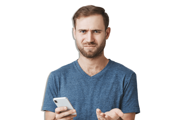 Man stands with a phone in his hand