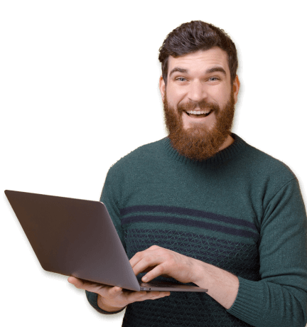 man smiling holding a laptop