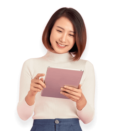 woman smiling looking at a tablet